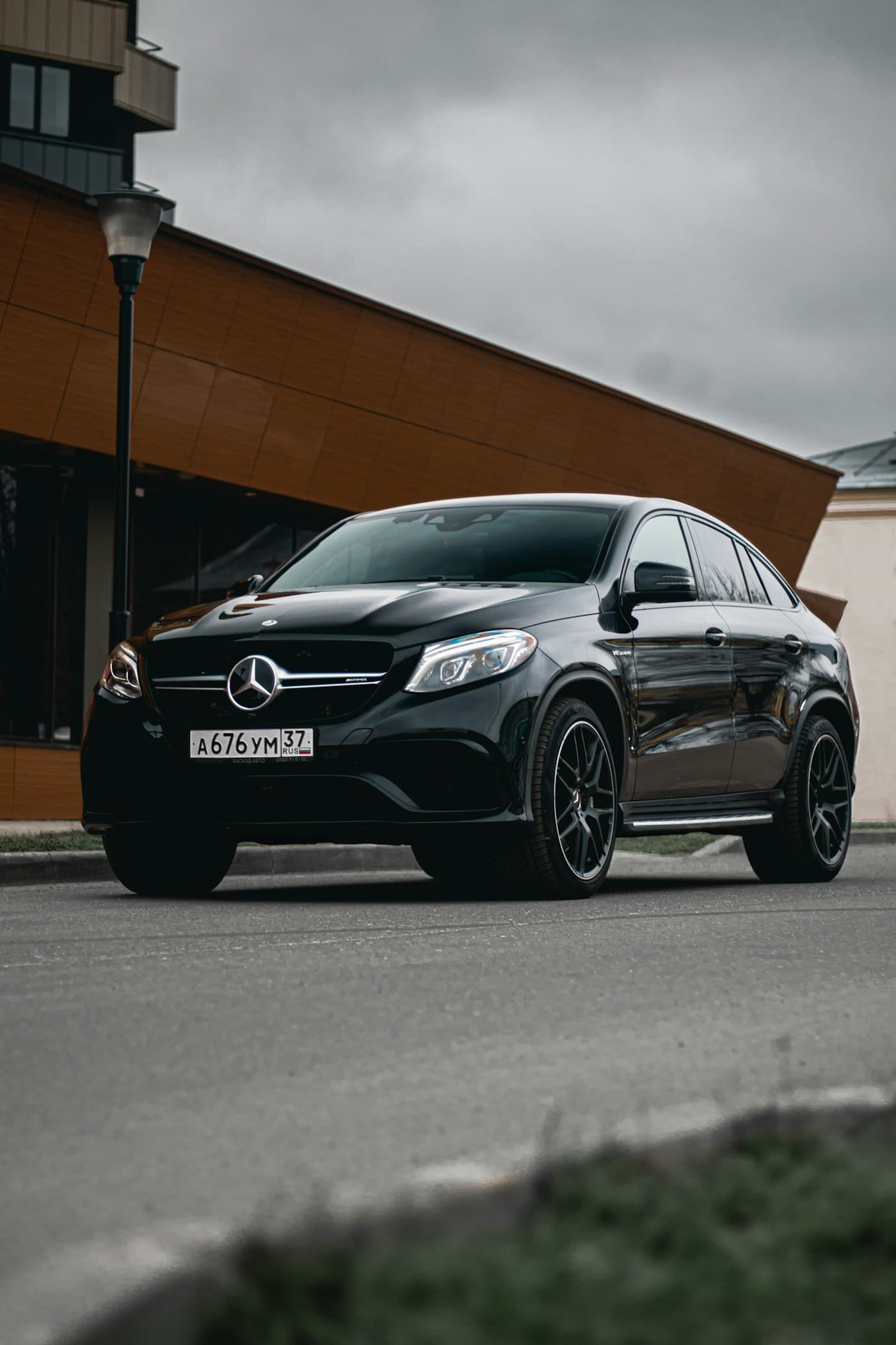 Black Mercedes-Benz GLE Coupé parked outside a building